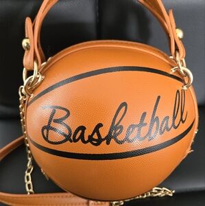 Basketball crosboddy purse with handles.